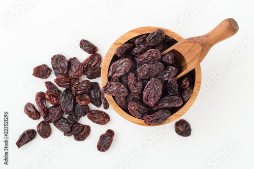 Jumbo raisins in wooden bowl photo