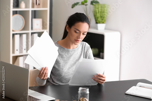 Young woman working with fi...