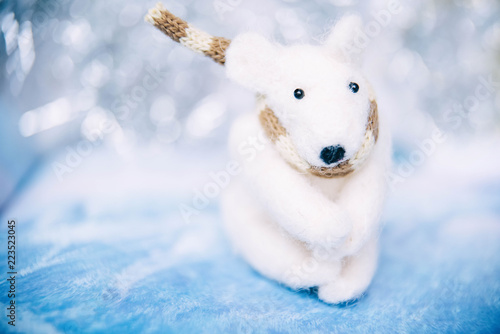 Holidays, winter and celebration concept - Christmas and new year card with toy polar bear. Blurred background.