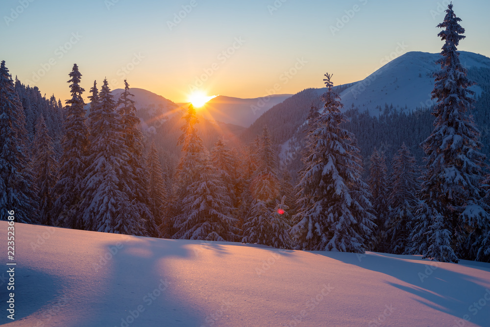 Magic sunset in the winter mountains after snowfall Magic sunset in the winter mountains after snowfall