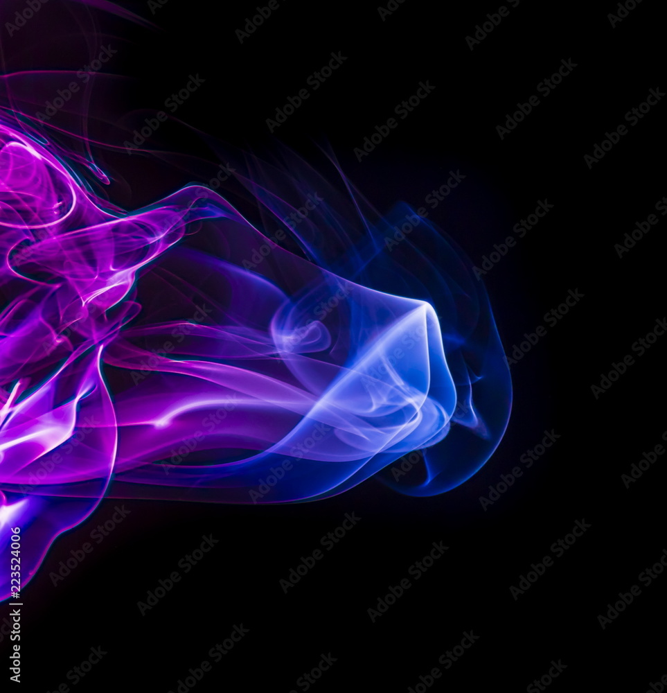 Colored smoke on black background