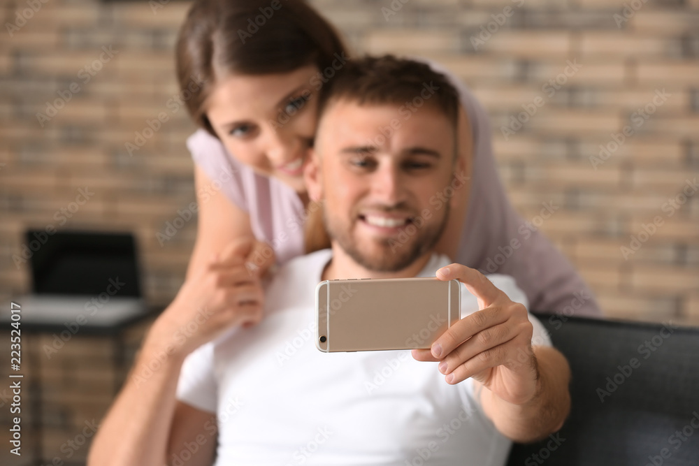 Happy loving couple taking selfie at home Happy loving couple taking selfie at home