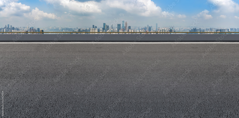 Naklejka premium Road pavement and Chongqing urban architecture skyline