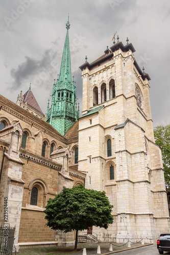 Side View of the tower of the St. Pierre Cathedral in Geneva, Switzerland, on a cloudy summer day