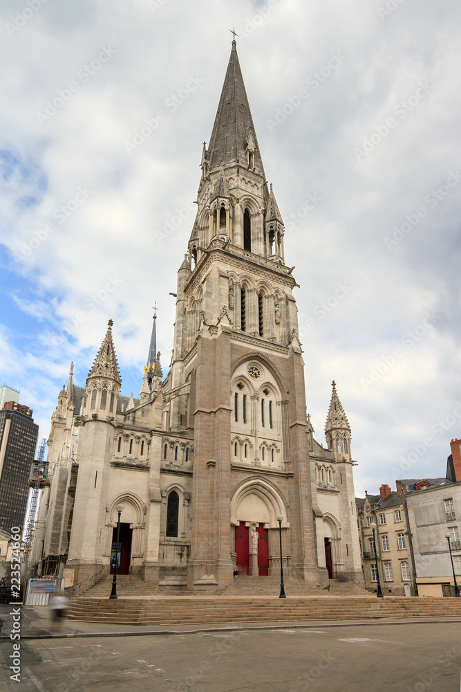 Beautiful cityscape view of the Basilique Saint-Nicolas de Nantes in the city of Nantes, France, on a summer day with clouds