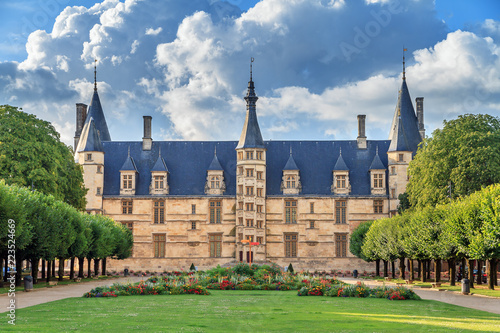 The 15th century historical monument Ducal Palace of Nevers (Palais ducal de Nevers) is the first of the river Loire‘s castles with its renaissance façade surrounded by the polygon turrets photo