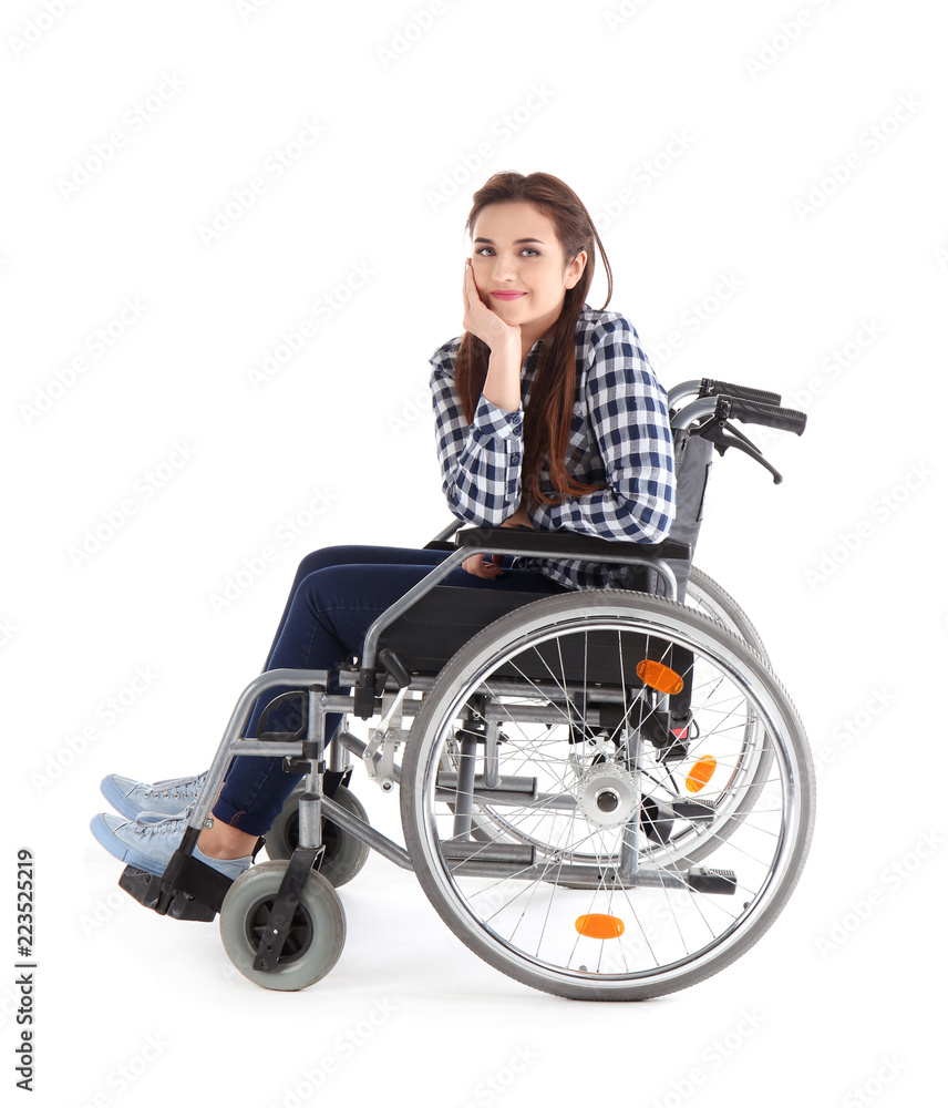Young woman sitting in wheelchair on white background Young woman sitting in wheelchair on white background