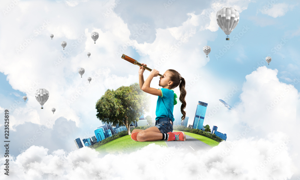 Concept of careless happy childhood with girl looking in future