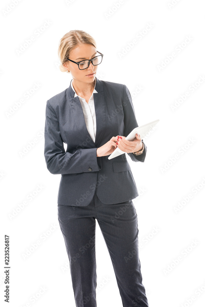 confident young businesswoman working with tablet isolated on white confident young businesswoman working with tablet isolated on white