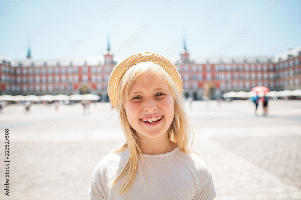 happy child in straw hat at Plaza Mayor in Madrid, Spain happy child in straw hat at Plaza Mayor in Madrid, Spain