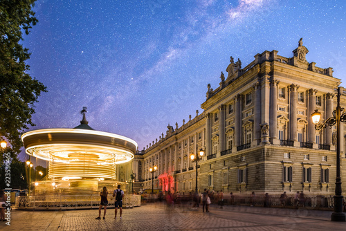 Royal Palace and carousel in Oriente Square in Madrid