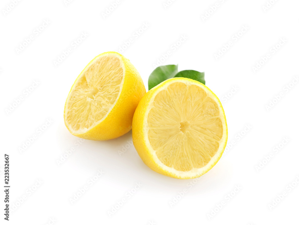 Halves of ripe lemon on white background