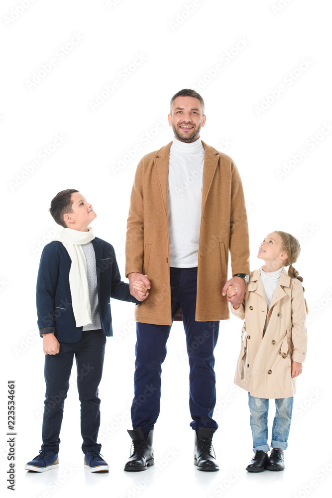 happy father holding hands with siblings in autumn outfit, isolated on white happy father holding hands with siblings in autumn outfit, isolated on white