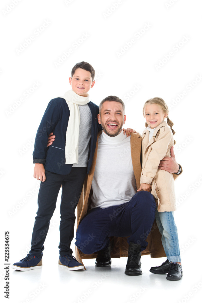 smiling father hugging stylish kids in autumn outfit, isolated on white smiling father hugging stylish kids in autumn outfit, isolated on white