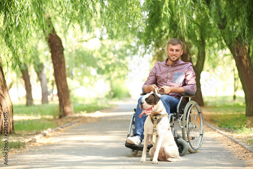 Young man in wheelchair and...