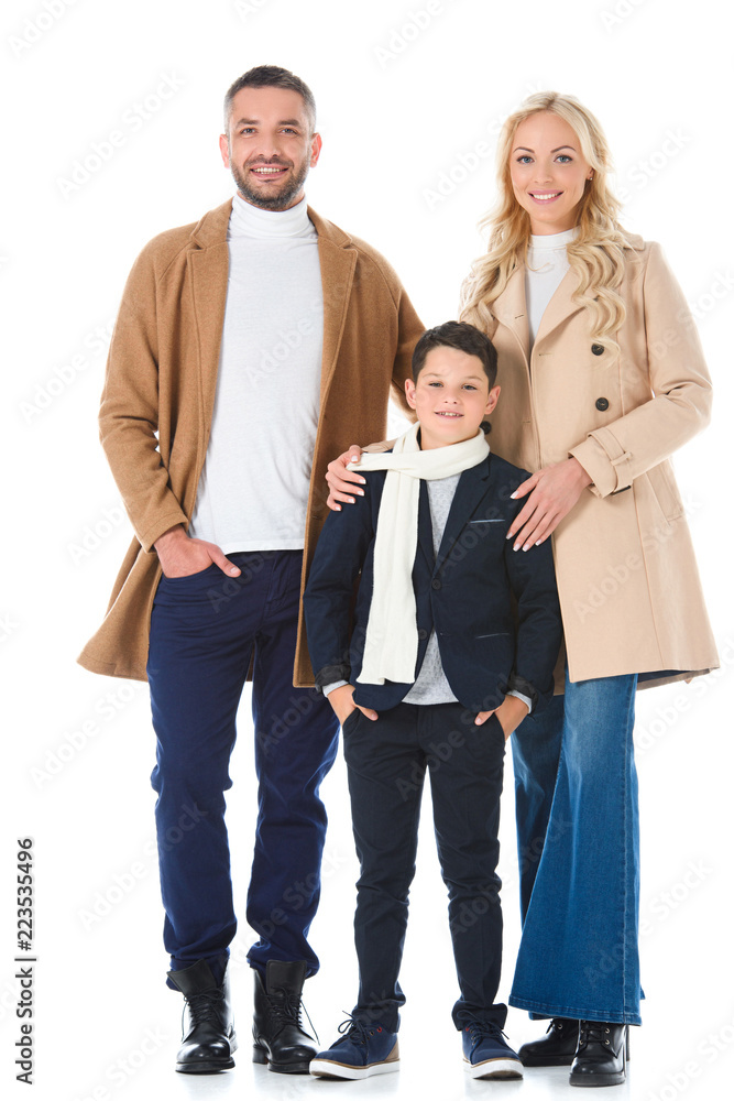 parents in beige coats hugging son in autumn outfit, isolated on white parents in beige coats hugging son in autumn outfit, isolated on white