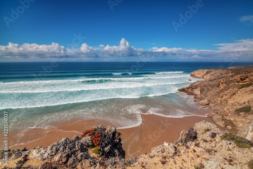 Calm clean sea with waves on Costa Vicentina Sagres. Algarve Portugal