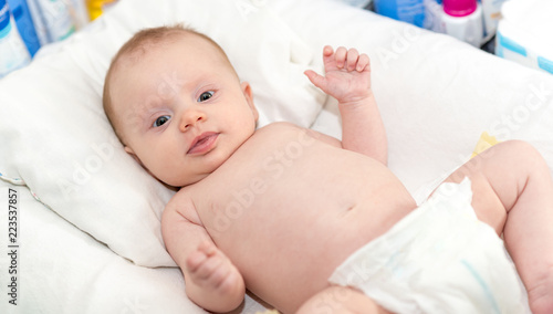 Portrait of cute baby girl in diaper