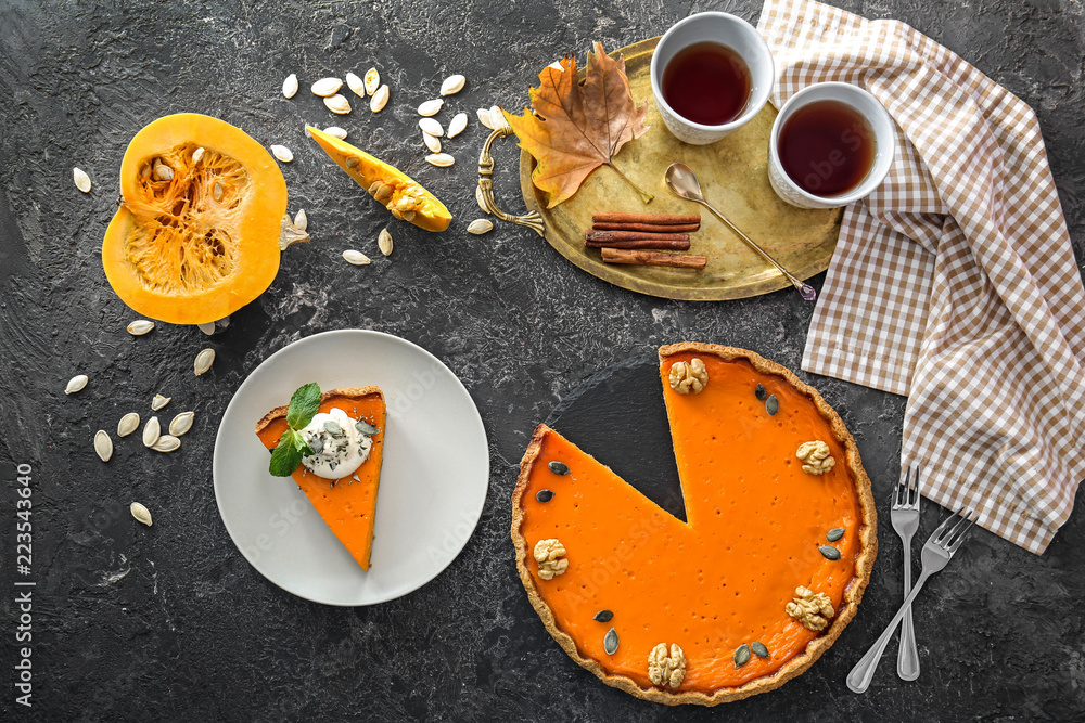 Flat lay composition with tasty pumpkin pie on table