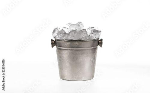 bucket with ice cubes for cooling on white background