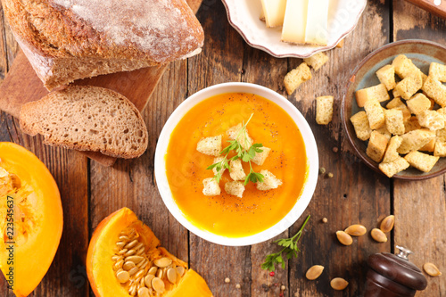 Принти на полотні pumpkin soup on wood background