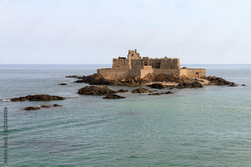 Beautiful view of tidal island Fort National at high tide in Saint-Malo, Brittany, France, a national heritage monument
