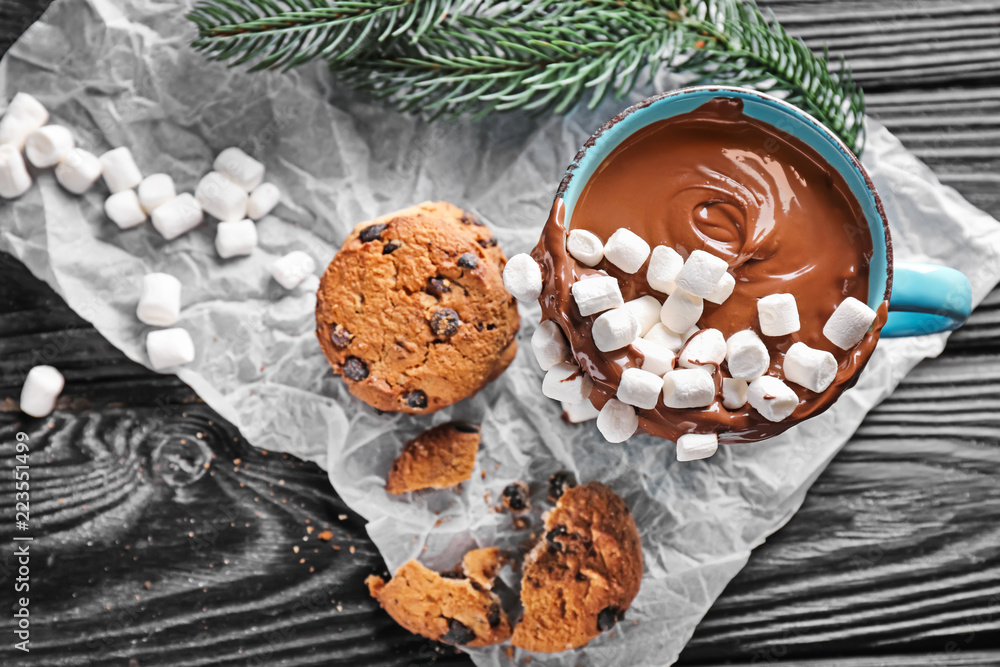 Cup of hot chocolate with marshmallows and cookies on wooden table Cup of hot chocolate with marshmallows and cookies on wooden table