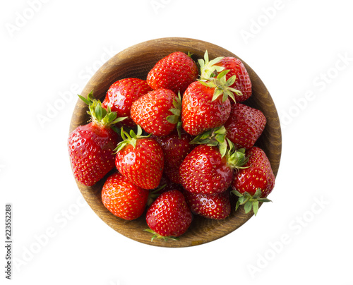 Top view. Bowls with strawberries isolated on white background. Ripe strawberries with a basil leaf close-up. Sweet and juicy berry with copy space for text.