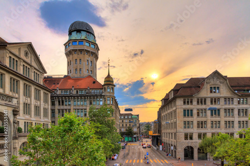 Beautiful cityscape looking towards the Urania Sternwarte observatory telescope in Zurich, Switzerland, with a beautiful sunset sky in summer photo