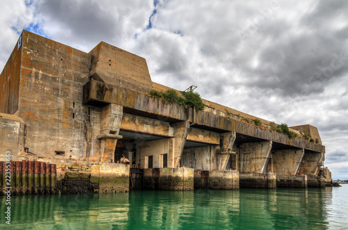 The Keroman Submarine Base structure K3, a WWII German U-boat facility, in Lorient, France, in summer with a beautiful cloudscape
