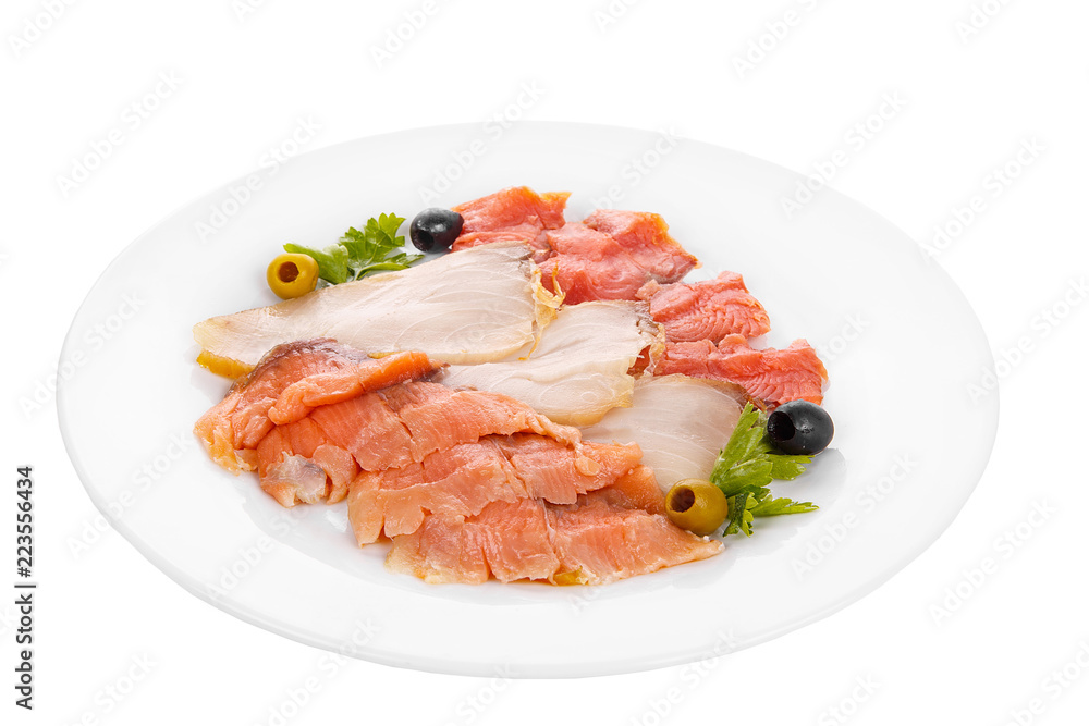 Cold appetizer before alcohol, assorted fish, salmon fillet, lightly salted, chum, smoked with wasabi sauce, mayonnaise, sour cream, olives, parsley on plate, white isolated background Side view Cold appetizer before alcohol, assorted fish, salmon fillet, lightly salted, chum, smoked with wasabi sauce, mayonnaise, sour cream, olives, parsley on plate, white isolated background Side view