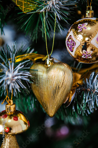 Christmas toy heart hangin on the Christmas tree