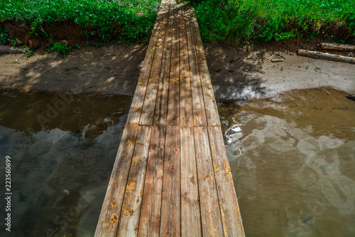 Small wooden bridge over the river