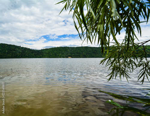 river in the forest and sky on the horizon