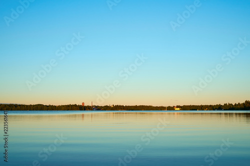 Peaceful sunset on lake with pastel colors. Natural background. 