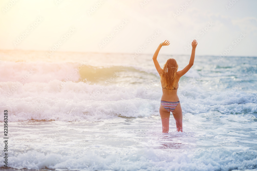Girl having fun on the tropical beach