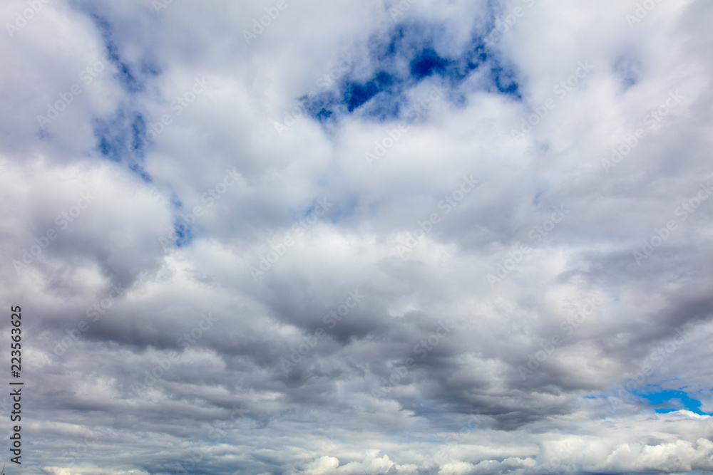 Clouds on a blue sky as a background Clouds on a blue sky as a background