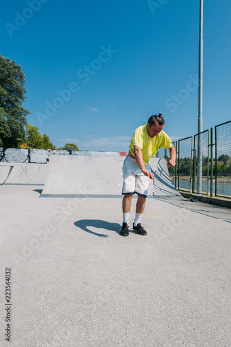 Young man doing tricks while jump in the air