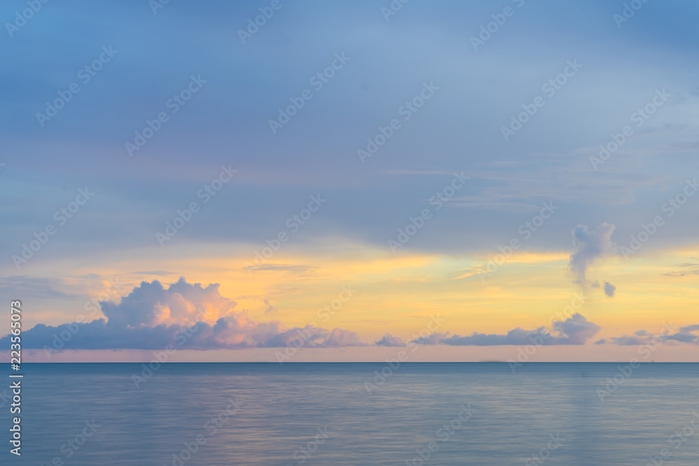 Beautiful beach sea on sunset background.