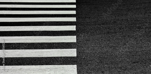 Vászonkép Zebra crosswalk on a asphalt road - closeup background