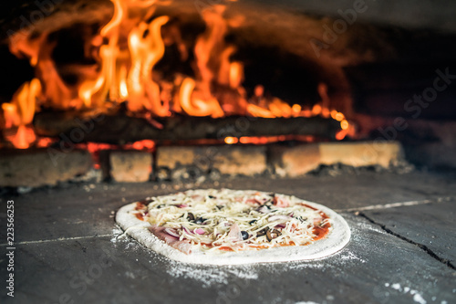 pizza preparations in a self-built wooden oven
