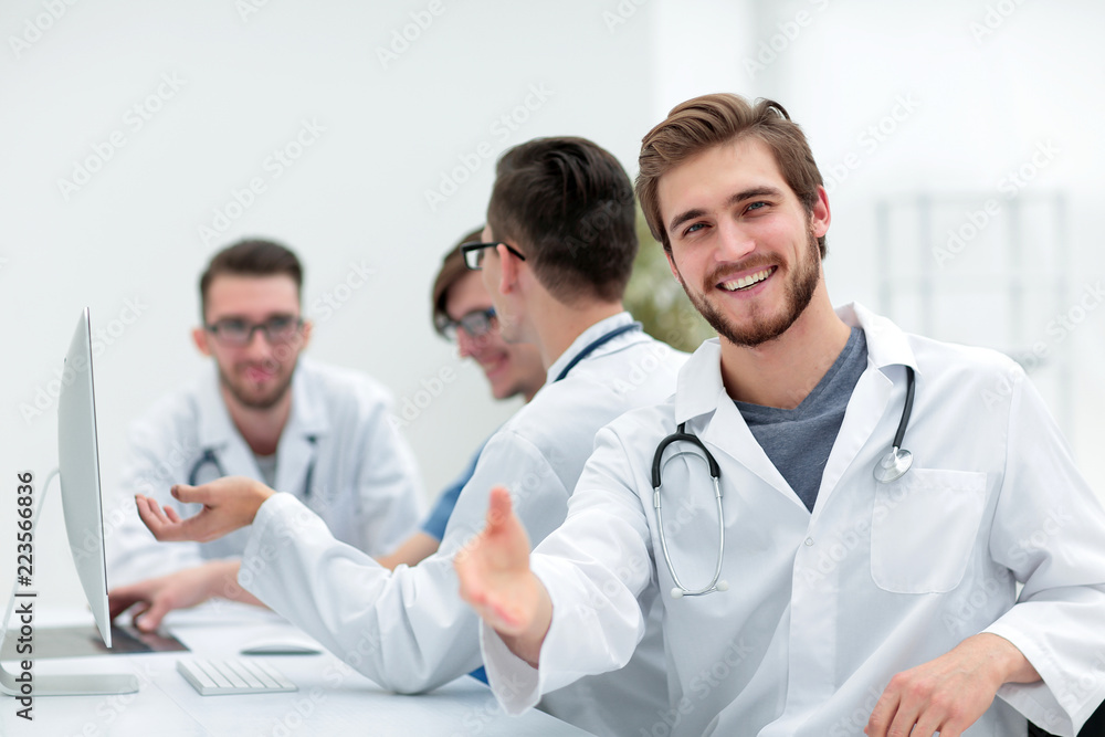 Handsome mature male doctor smiling to the camera Handsome mature male doctor smiling to the camera