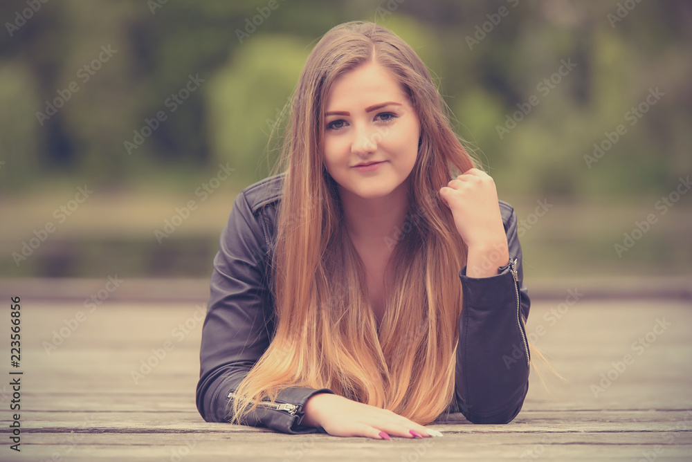 Beautiful woman posing on the wooden pier Beautiful woman posing on the wooden pier