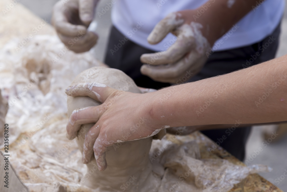 Hands make a man's head from clay Hands make a man's head from clay