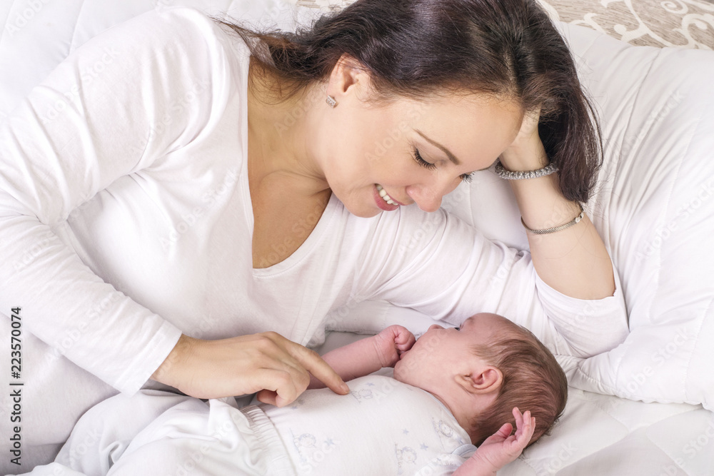 Gentle mama lying near dormant kid Gentle mama lying near dormant kid