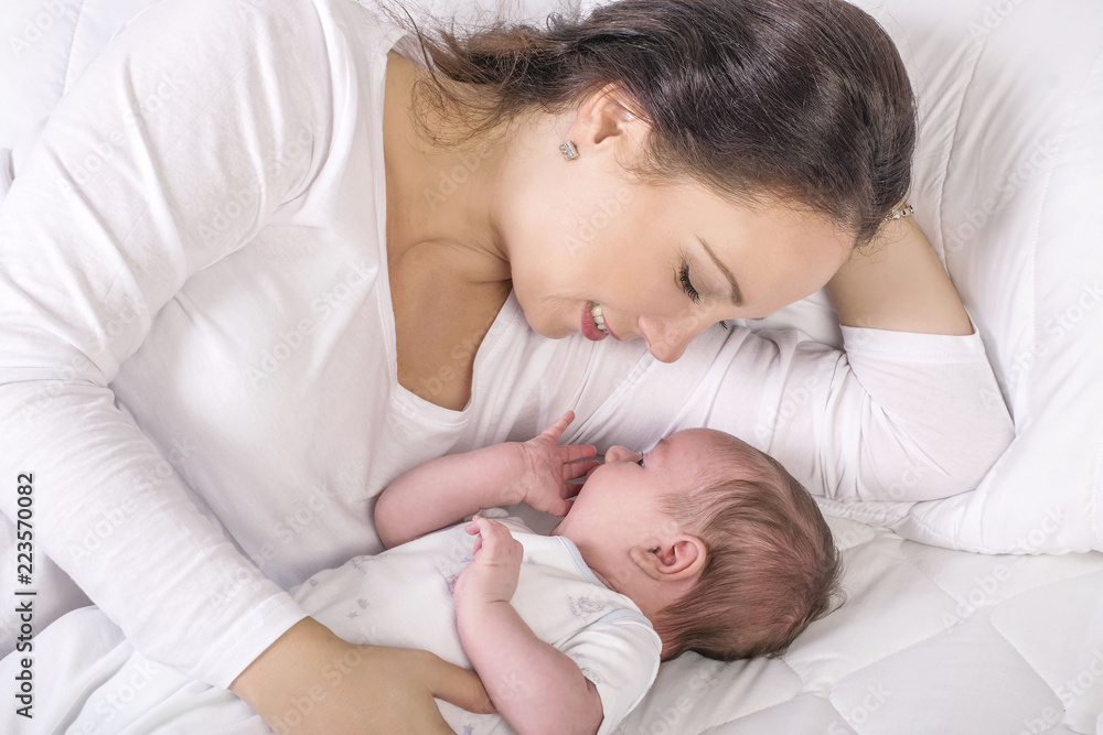 Gentle mama lying near dormant kid Gentle mama lying near dormant kid