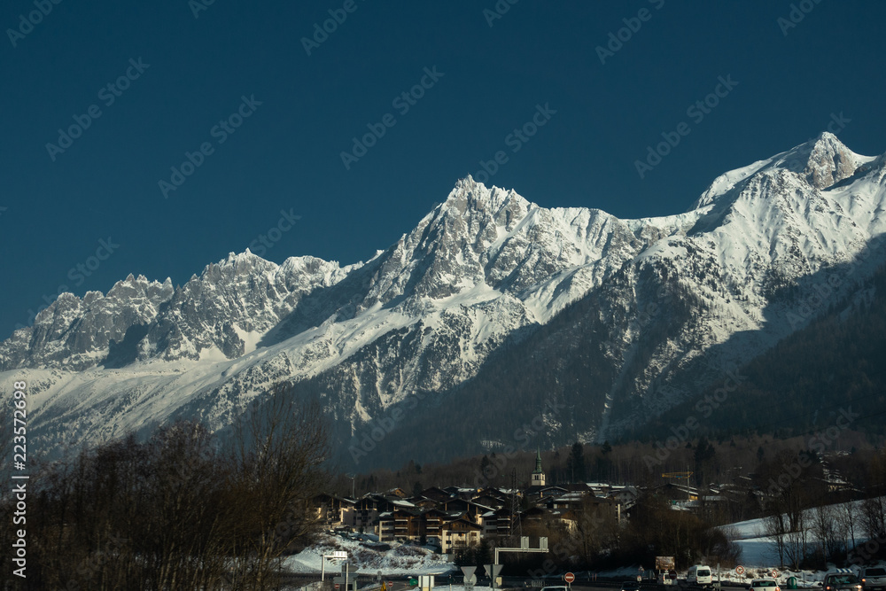 Big snowy mountains above the village