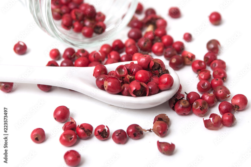 closeup of Red peppercorn aroma condiment on white background closeup of Red peppercorn aroma condiment on white background