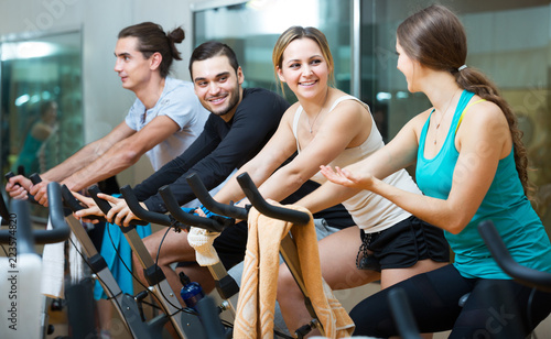 People training on exercise bikes