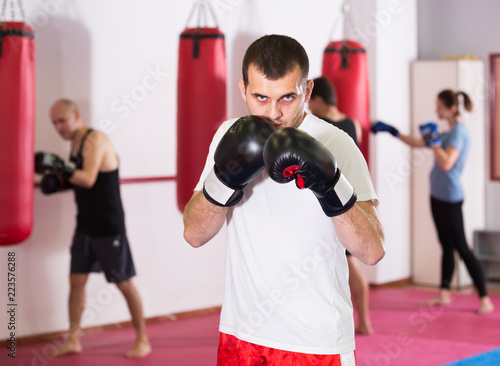 serious sportsman in the boxing hall practicing boxing punches © JackF